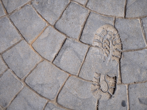 making your mark - shoeprint in cement