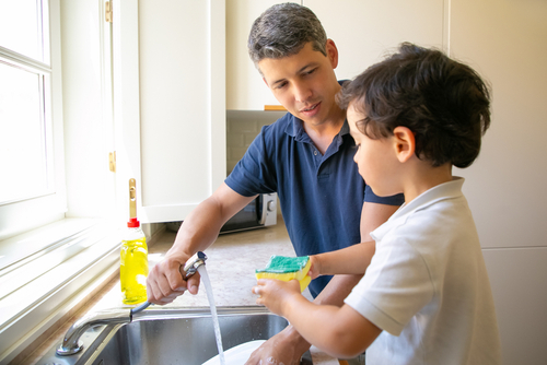 washing dishes at picture window