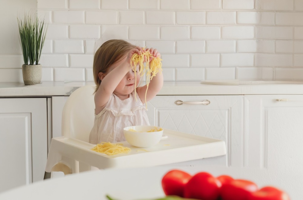 baby playing with food