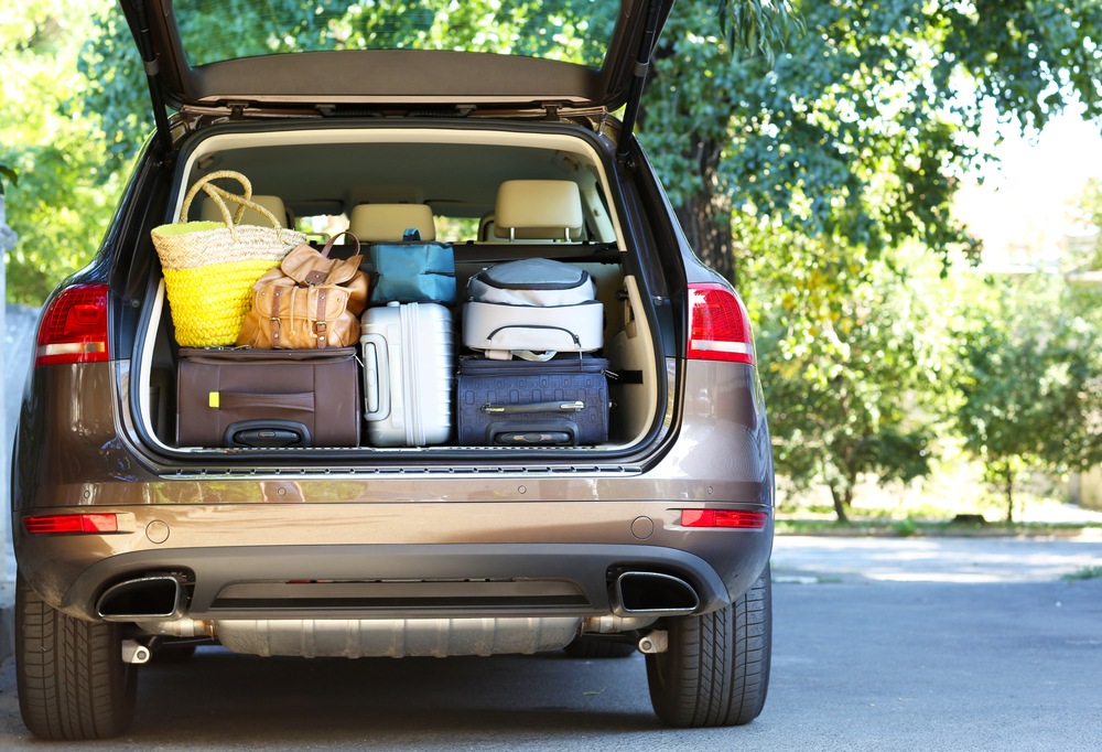 trunk of an suv loaded with luggage