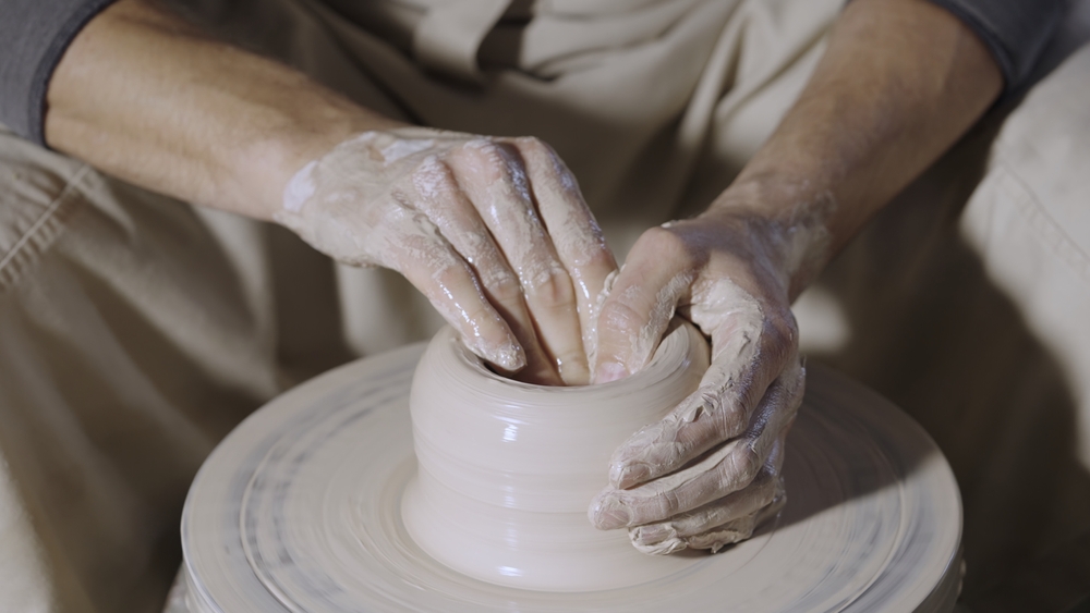 Man creating pottery