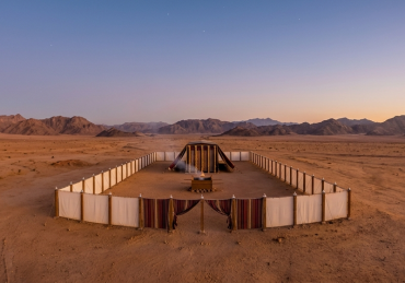 A wide panoramic view of the biblical Mishkan sanctuary layout in the open desert, illustrating how Hashem appreciates your effort in every quiet spiritual victory.