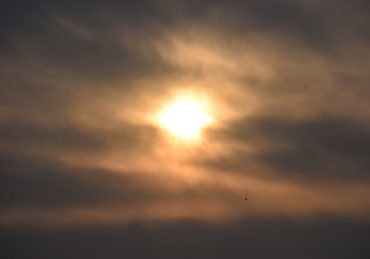 The Jewish view of suicide and the spiritual value of life represented by light breaking through dark storm clouds.