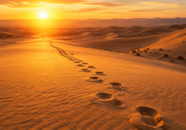 Footprints stretching across the desert, symbolizing the 42 journeys of the Jewish People in Parashat Masei.